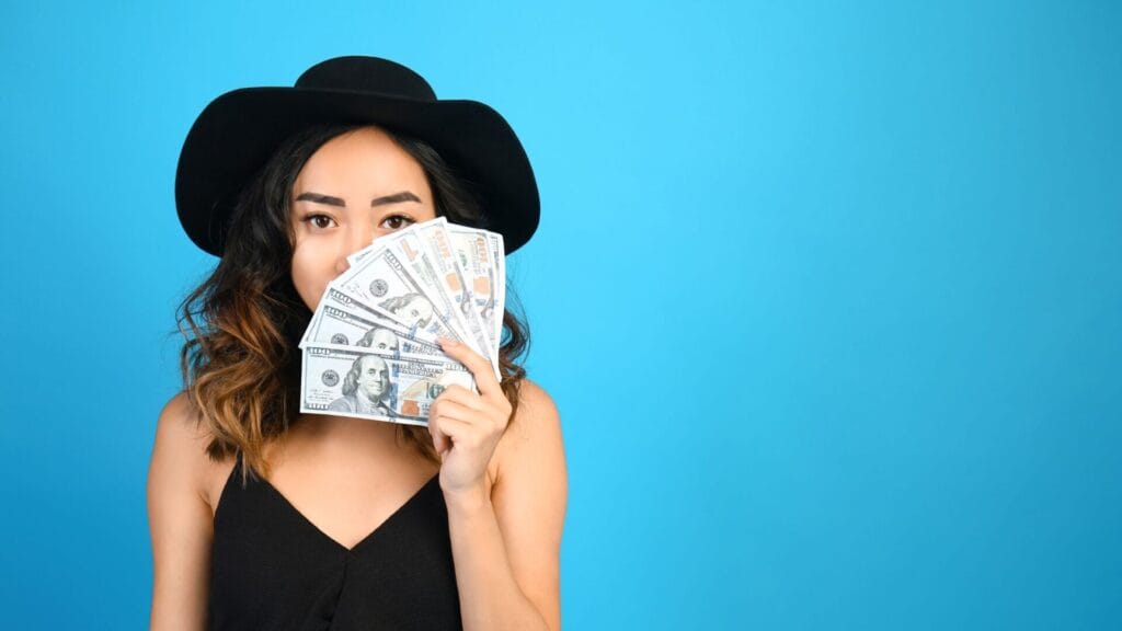 how to get paid with zoho - woman on blue background flashing money